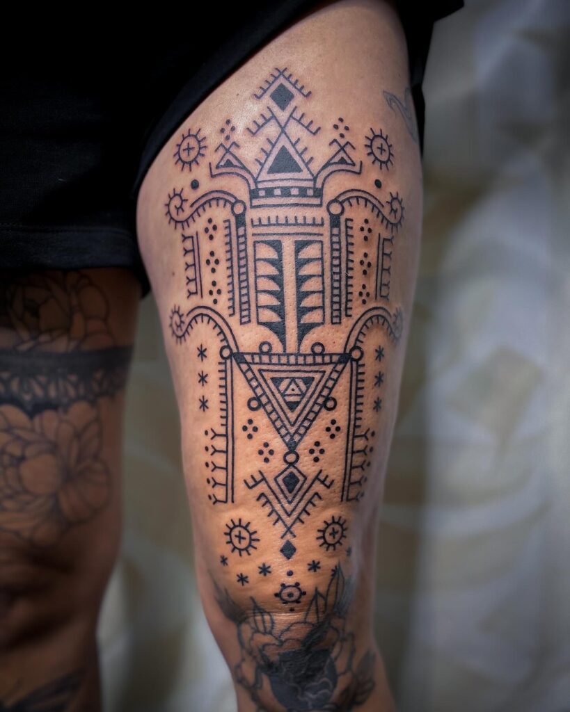 Filipino Tribal Chest And Arm Tattoo