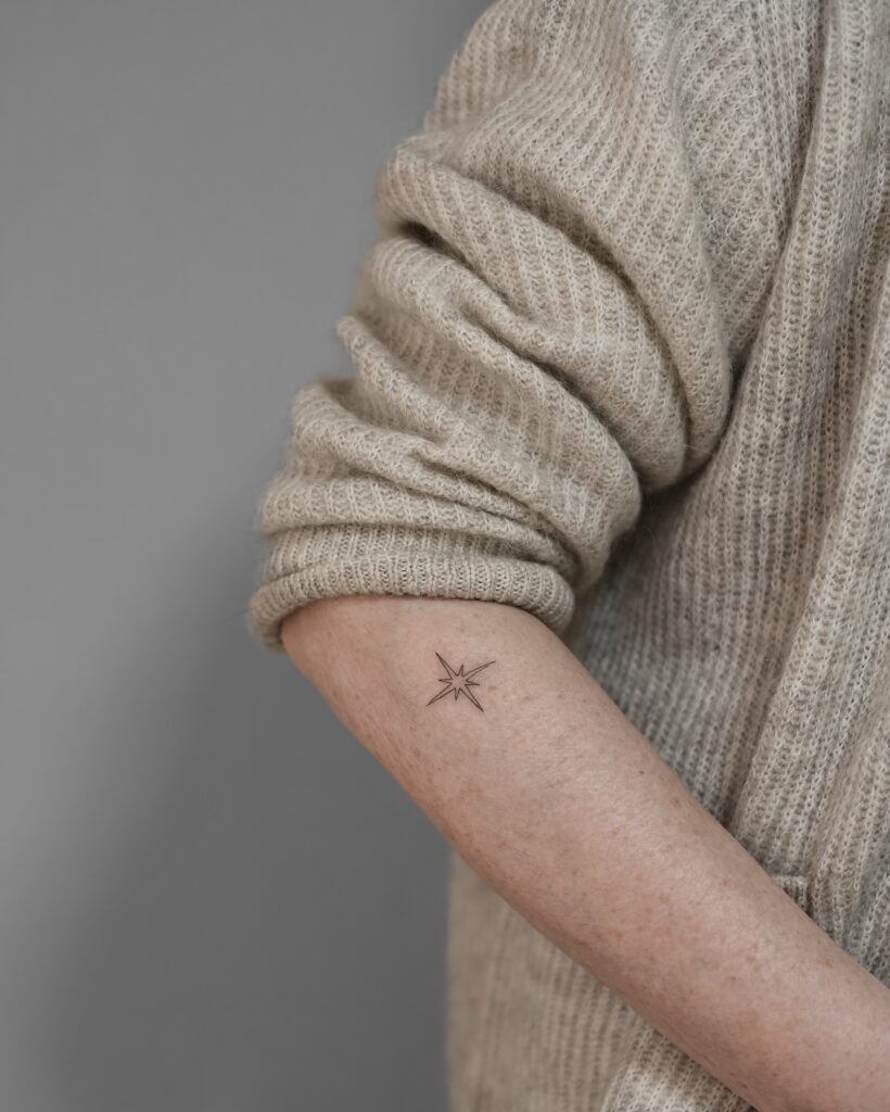North Star Spark Forearm Tattoo