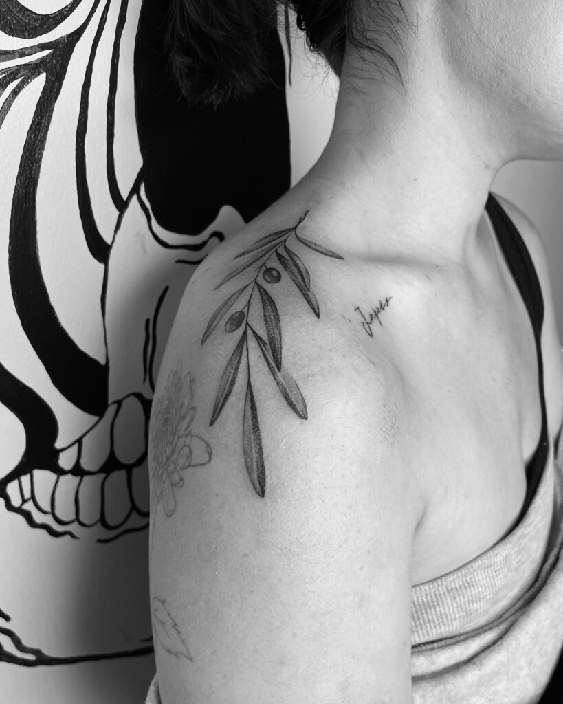 Red Ink Infinity Sun Shoulder Tattoo