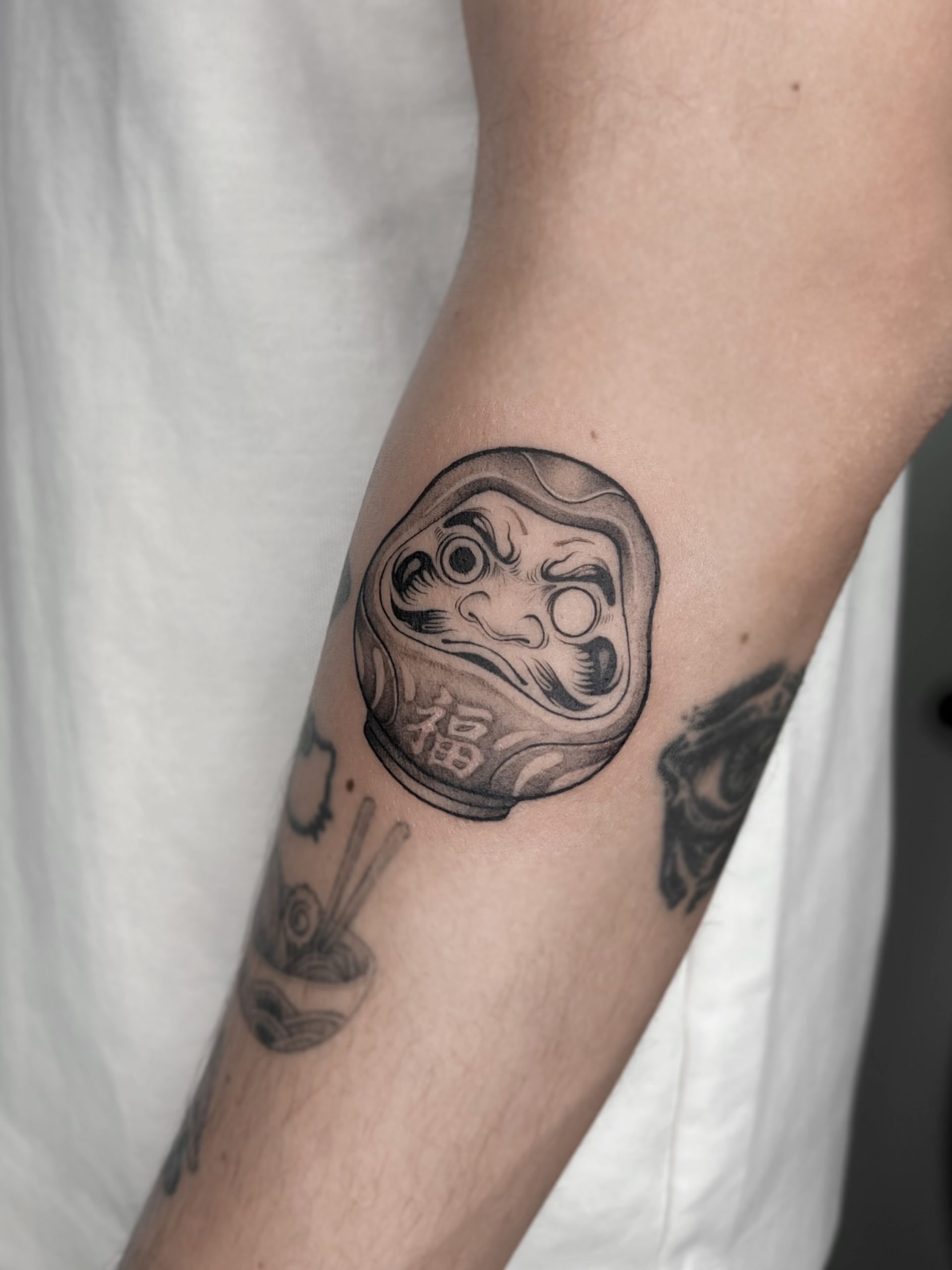 One Eyed Daruma Tattoo