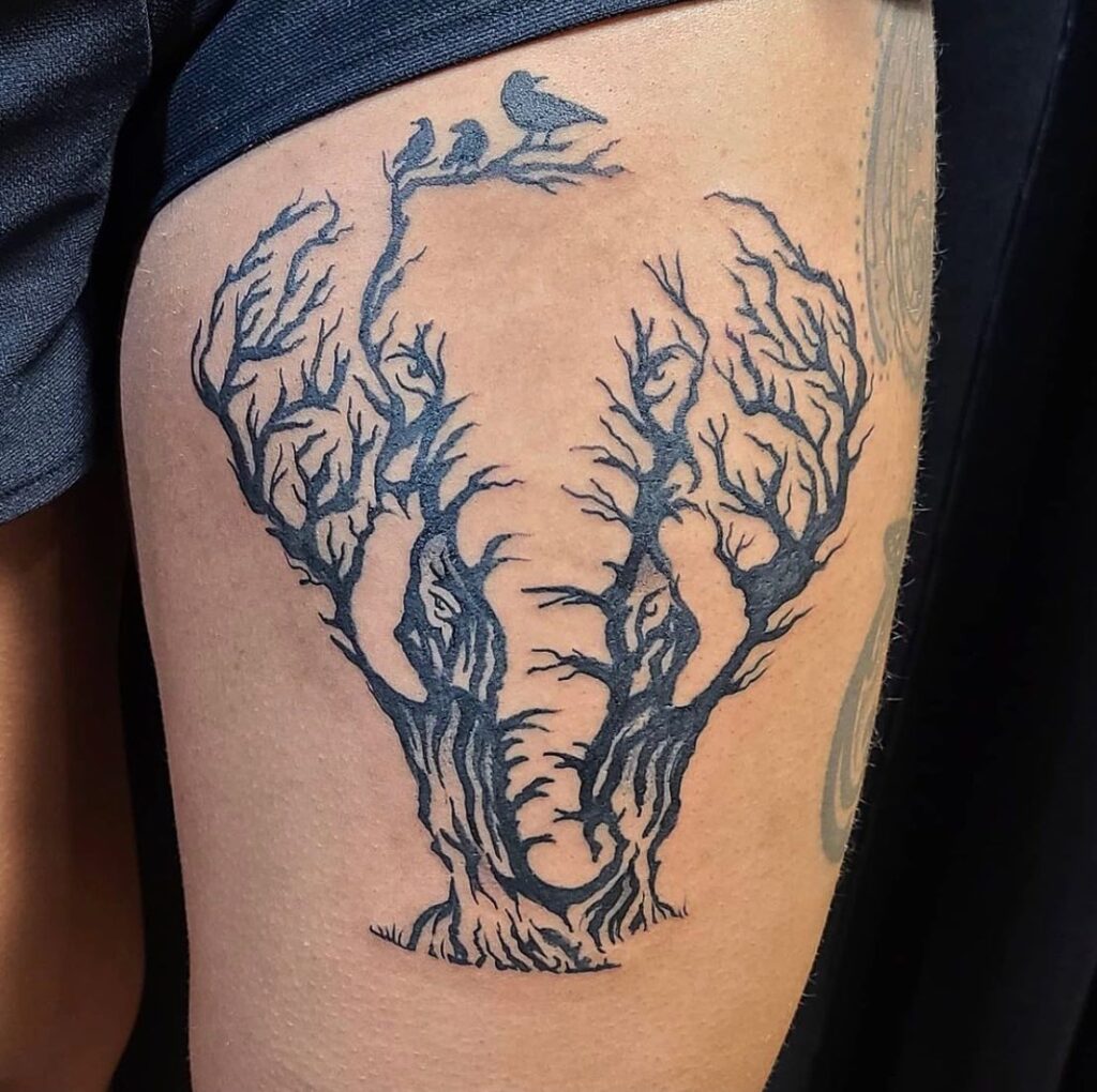 Elephant silhouette created from tree branches