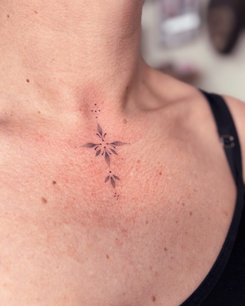 Ornamental Floral Sternum Tattoo meaningful tiny tattoos tattoo
