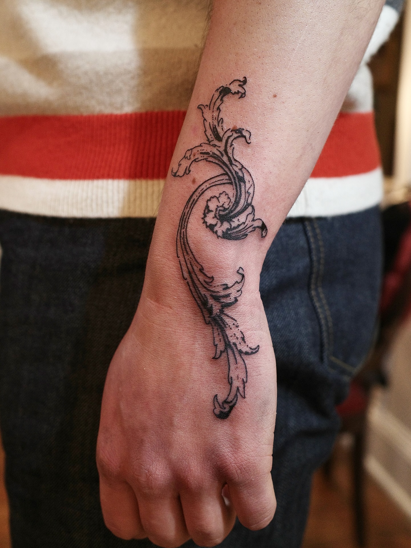 Ornamental Flow Wrist Tattoo