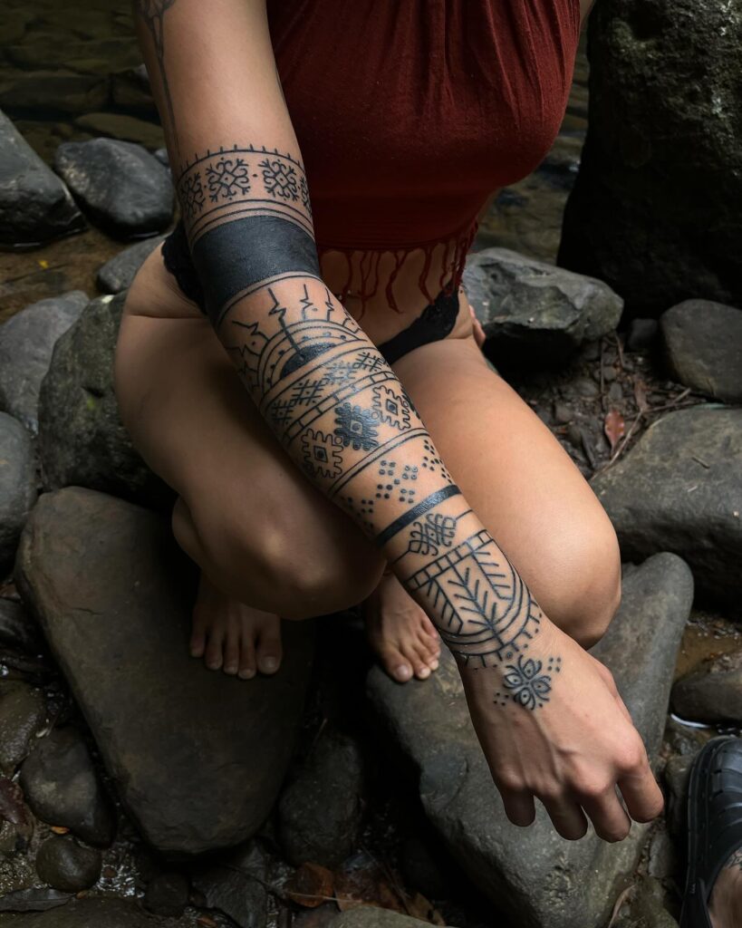 Polynesian-Inspired Tribal Leg Sleeve Tattoo