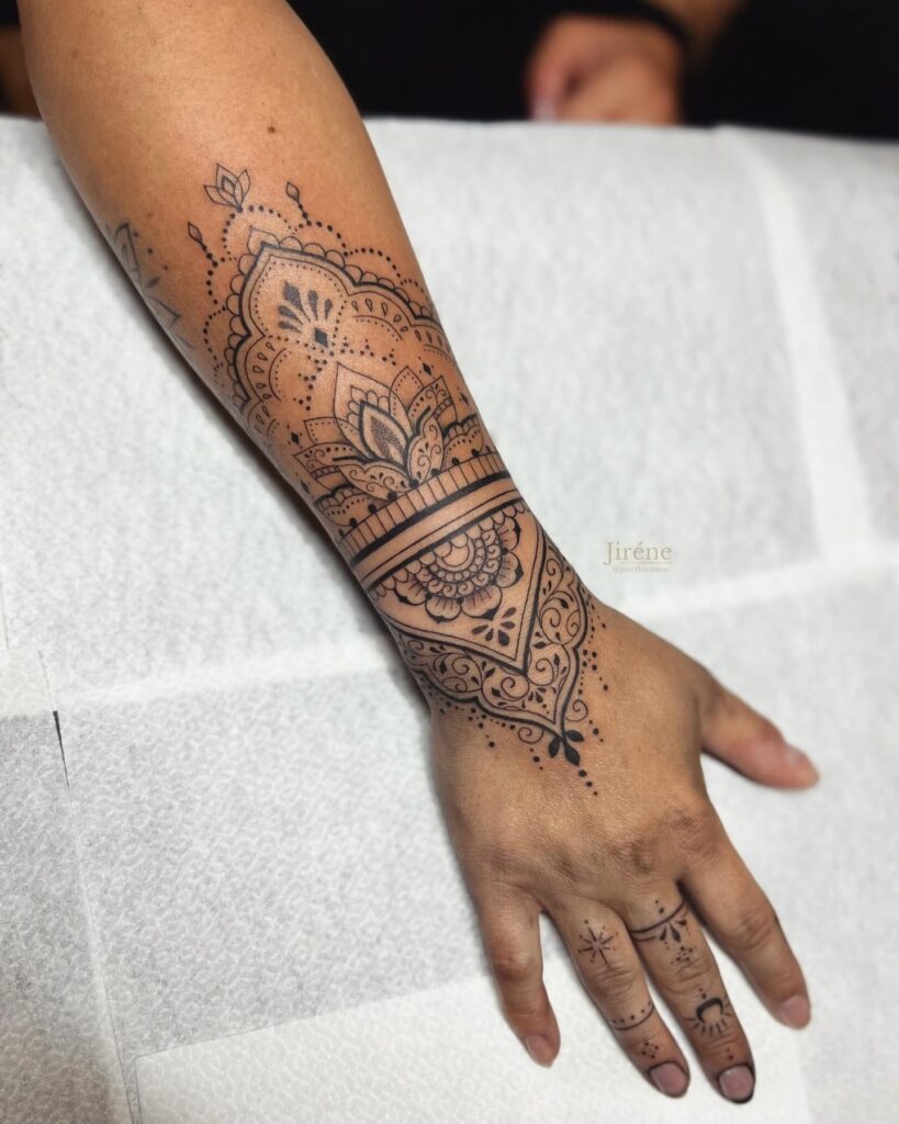 Ornamental Mandala Wrist and Hand Tattoo mandala wrist tattoo ideas tattoo