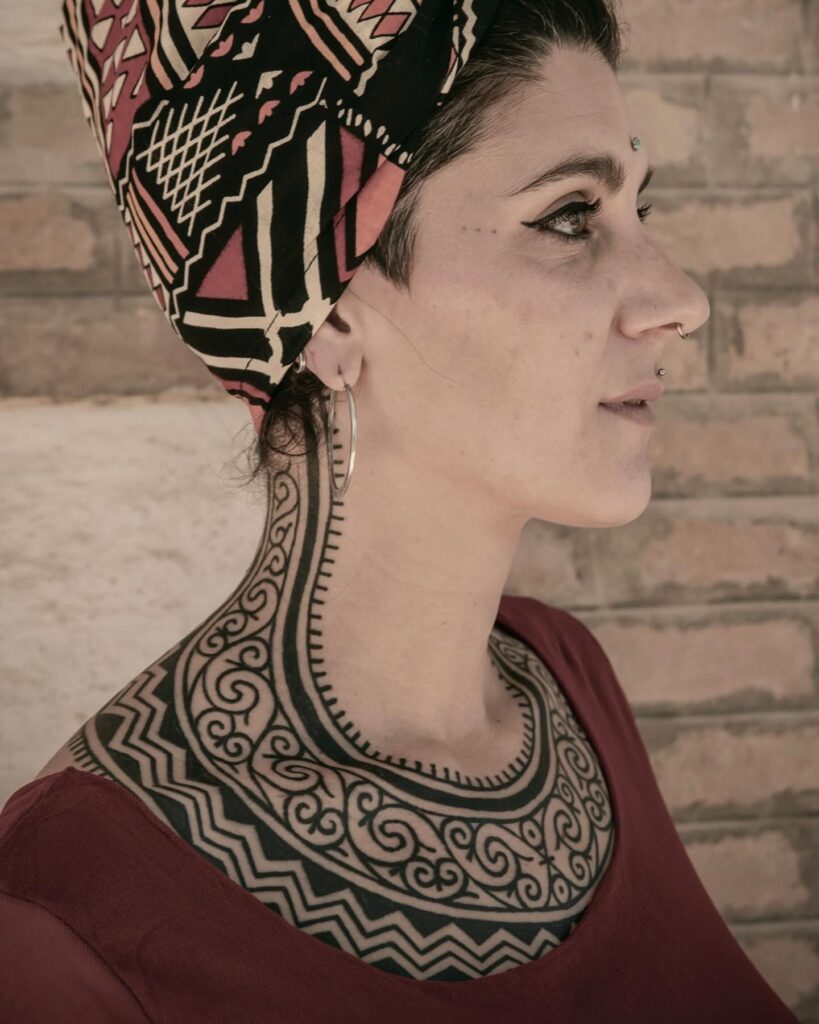 Polynesian Tribal Chest And Shoulder Tattoo