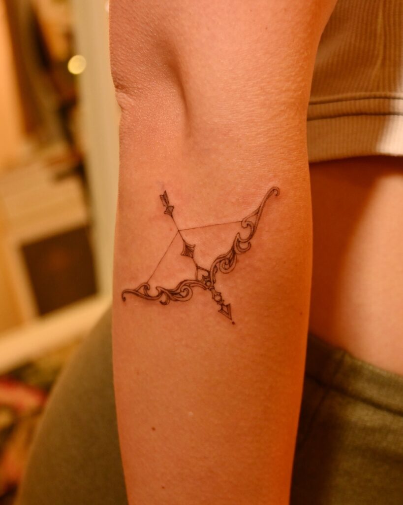Ornate Bow and Arrow meaningful tattoos to check out tattoo