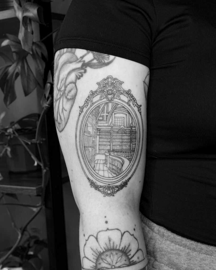Woman With Library Bun Tattoo