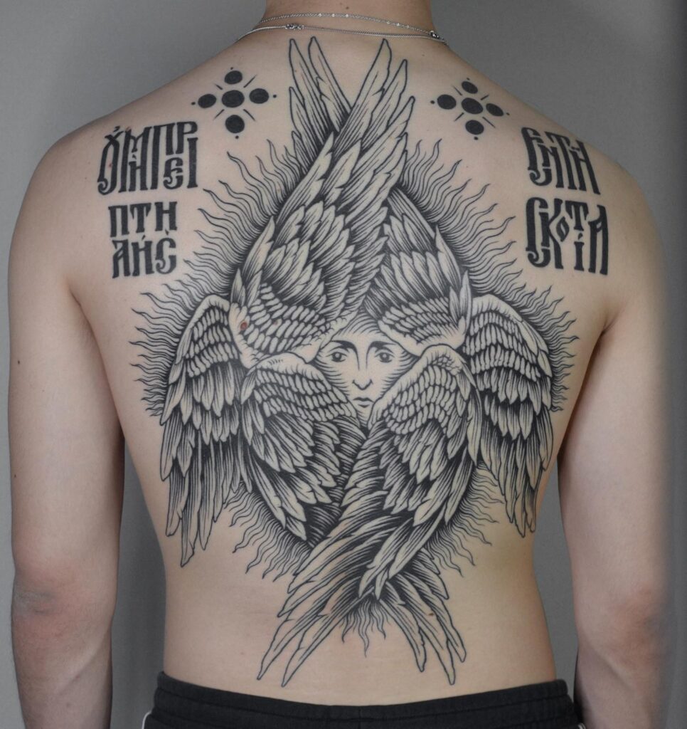 Orthodox-Inspired Seraphim Back Tattoo with Winged Face seraphim angel tattoo ideas tattoo