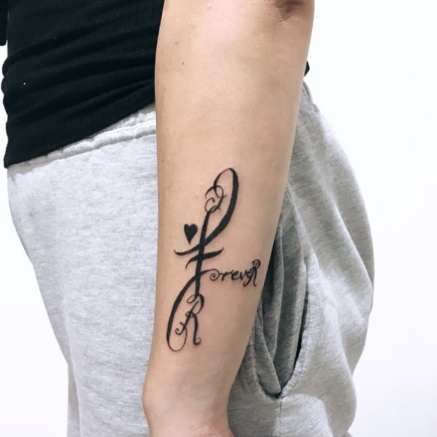 Small outer forearm tattoo placement