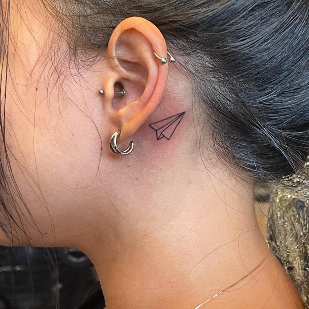 Playful Character Behind-the-Ear Tattoo behind the ear tattoos tattoo