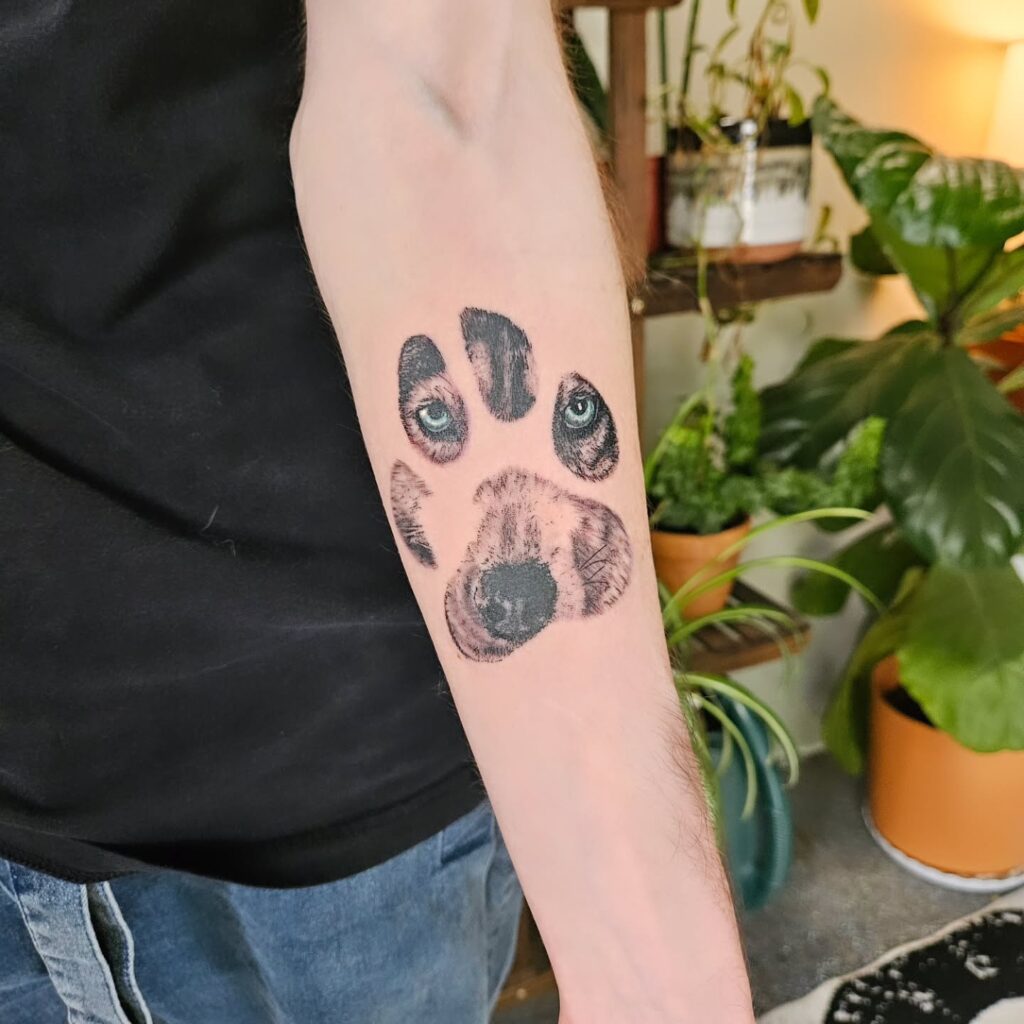 Paw Print Tattoo with Pet Portrait Eyes paw print tattoo ideas tattoo