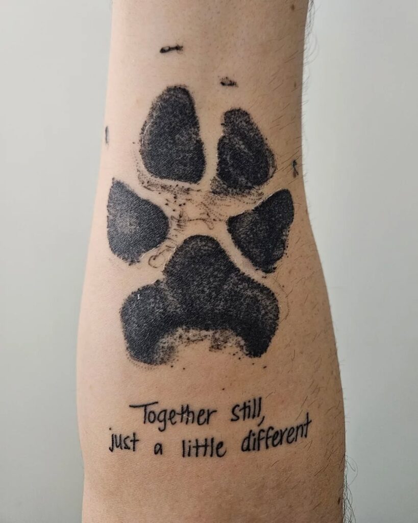 Paw Print Tattoo with Sentimental Quote paw print tattoo ideas tattoo