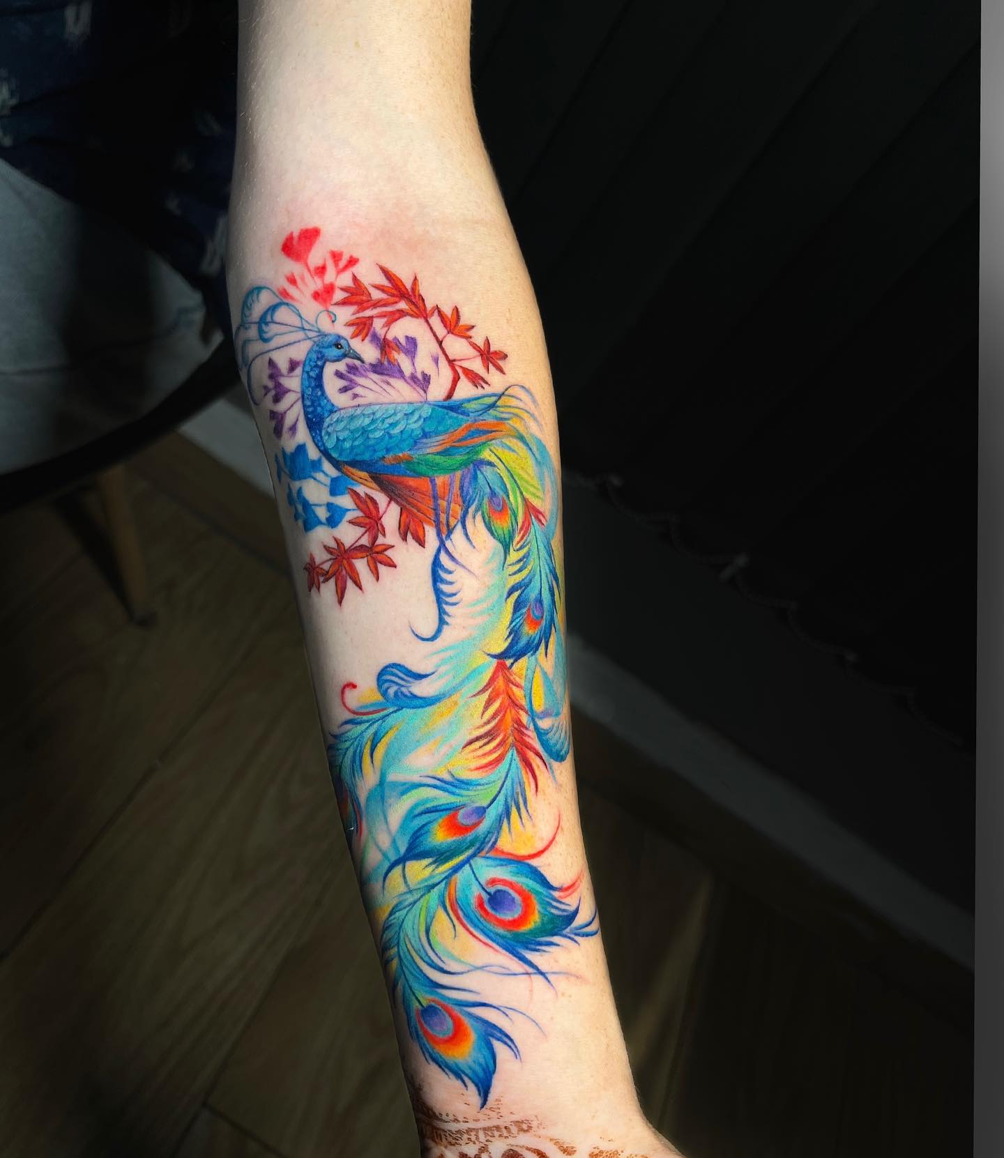 Colorful Flowing Peacock Feather Tattoo