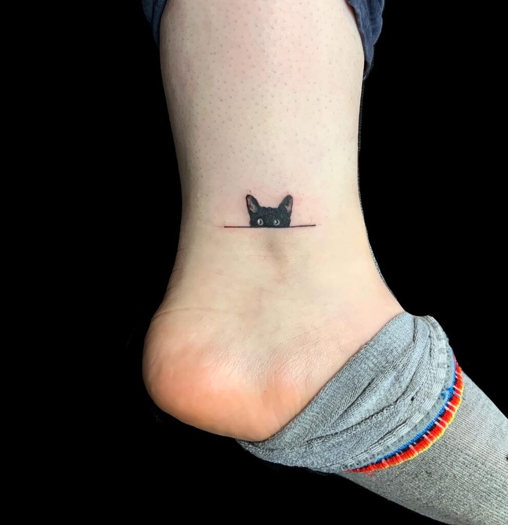 Peeking Black Cat Ankle Tattoo small cat tattoos tattoo
