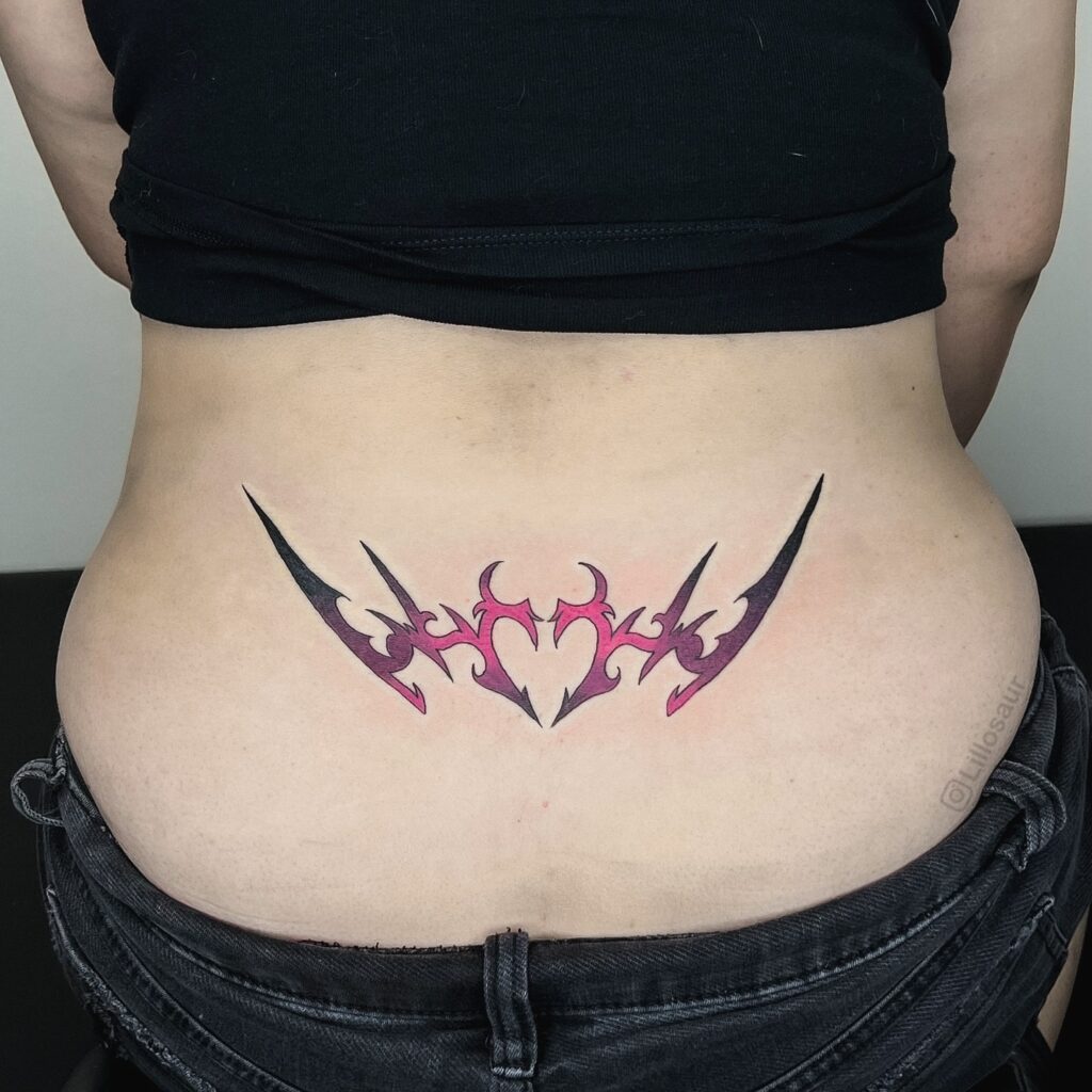 Minimal Tribal Lower Back Tattoo