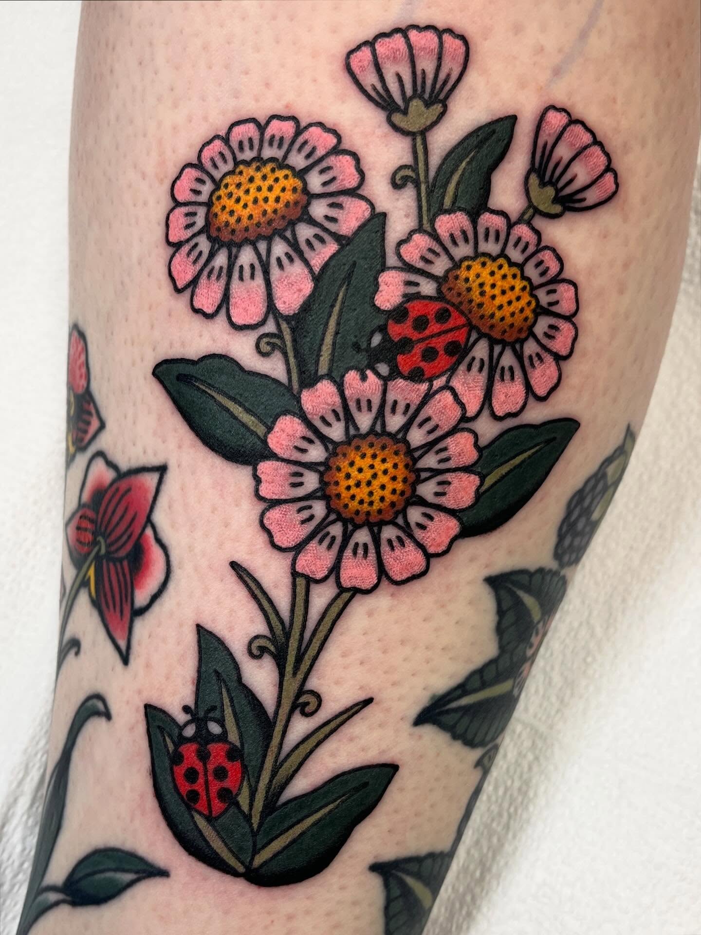 Daisy Bouquet and Hummingbird Tattoo daisy tattoo ideas tattoo