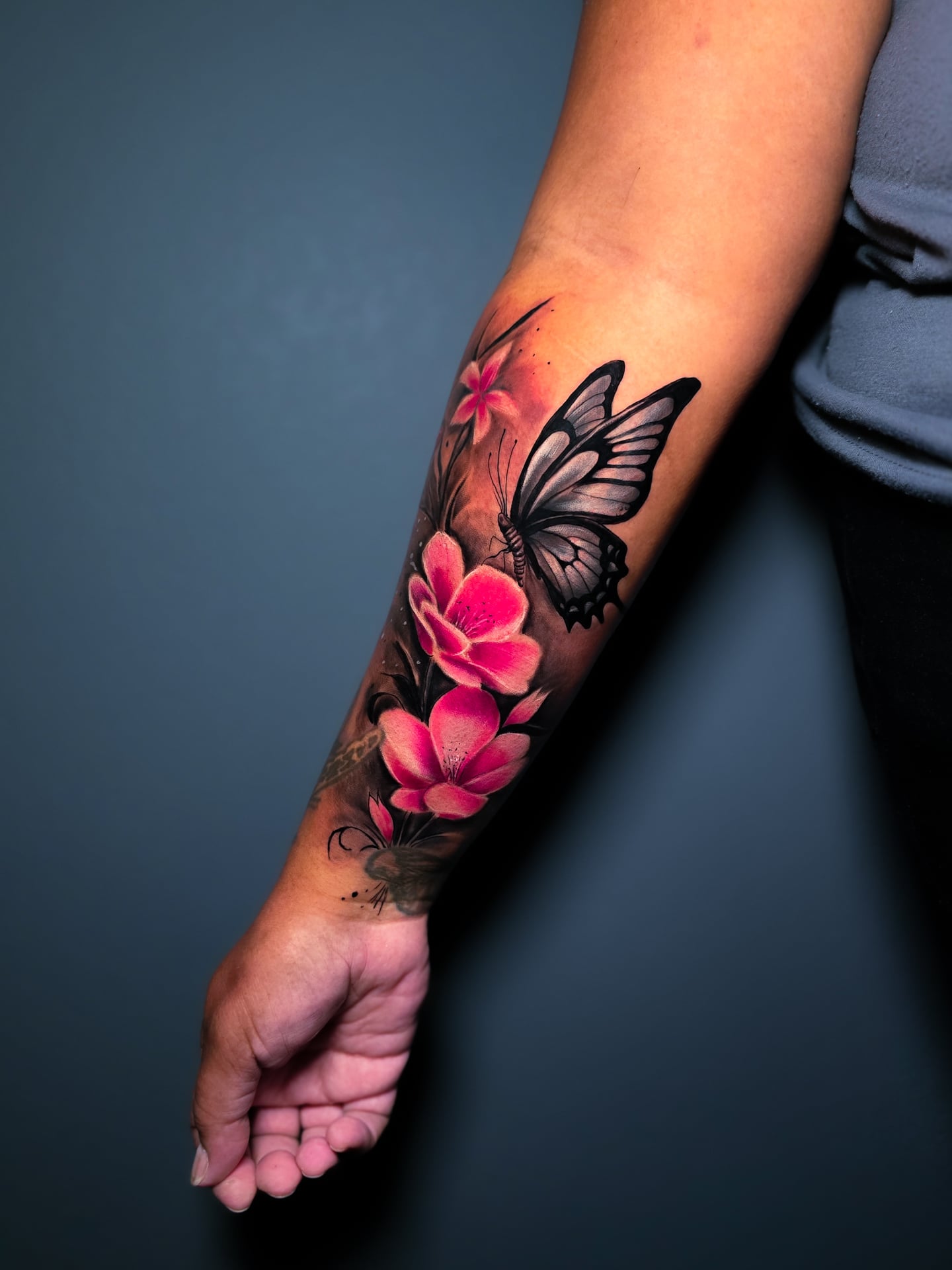 Pink Flower Butterfly Forearm Tattoo butterfly tattoos designs tattoo
