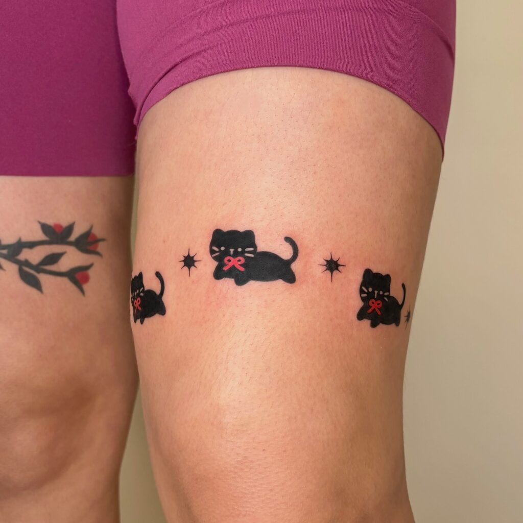 Playful Black Cat Band Tattoo