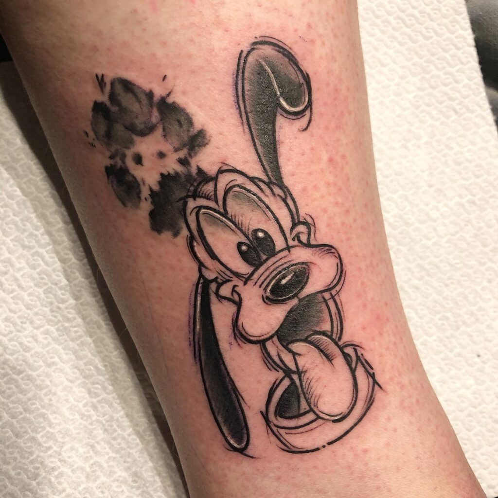 Playful Cartoon Dog with Paw Print Tattoo dog memorial tattoos tattoo