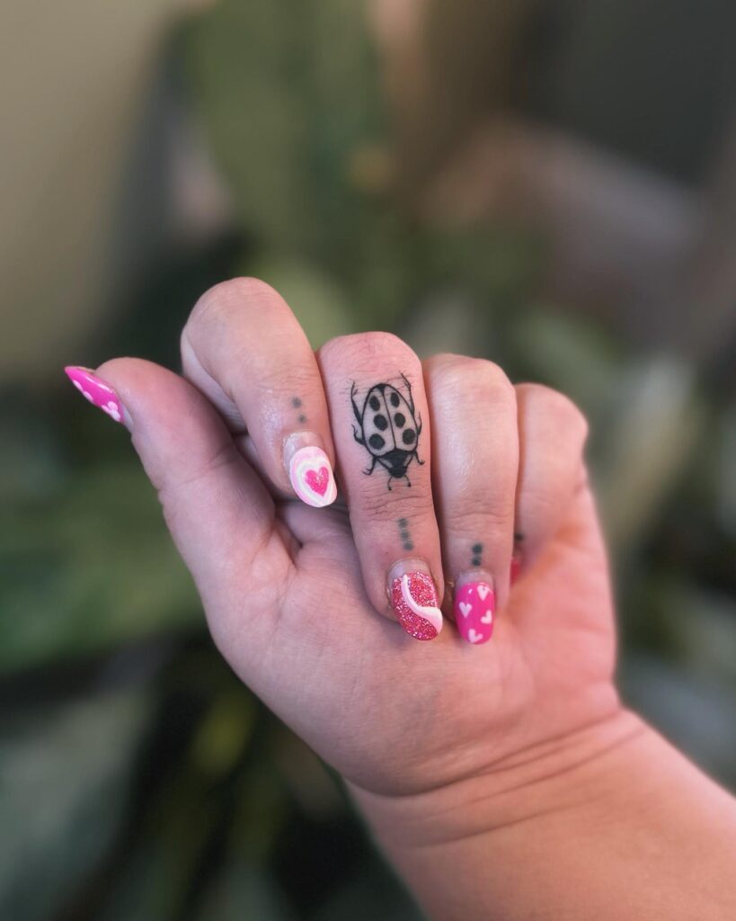 Vibrant Floral Finger Tattoos