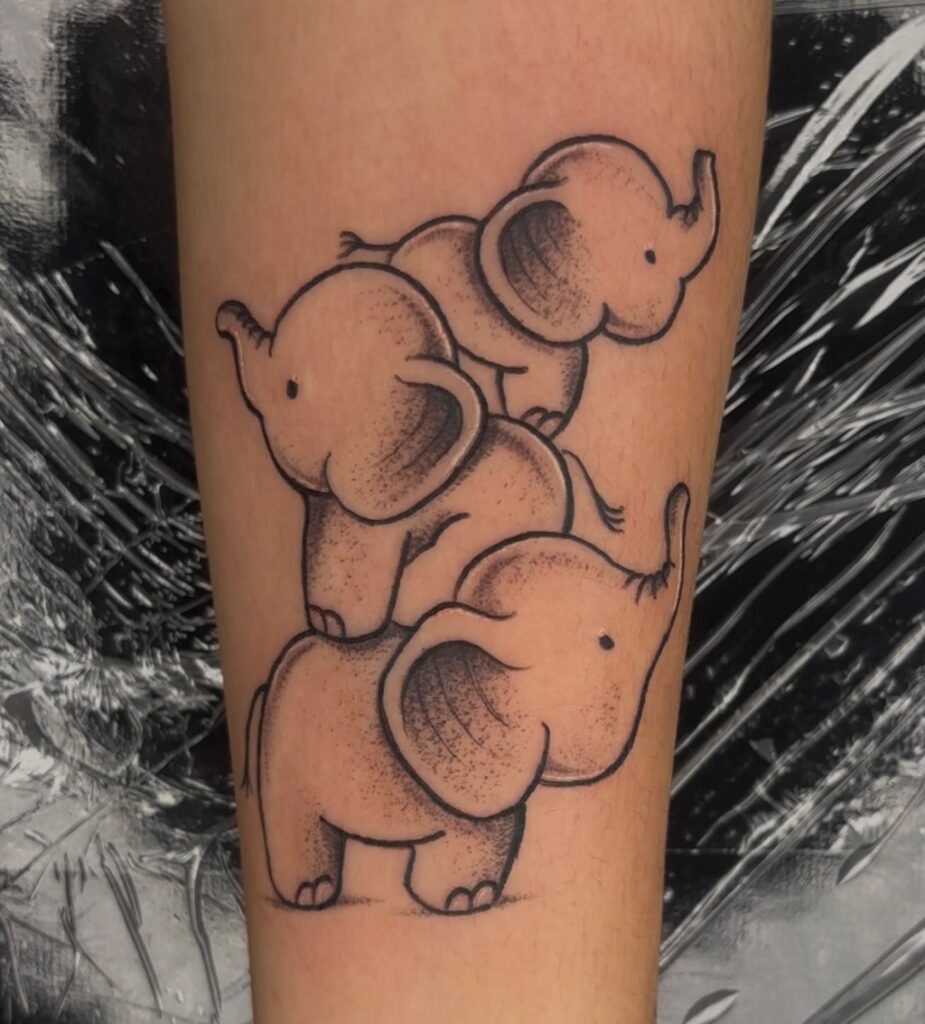 Playful Stack of Baby Elephants Tattoo elephant family tattoo ideas tattoo