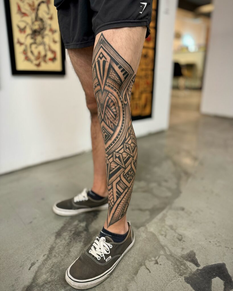 Polynesian-Inspired Blackwork Leg Sleeve Tattoo Design