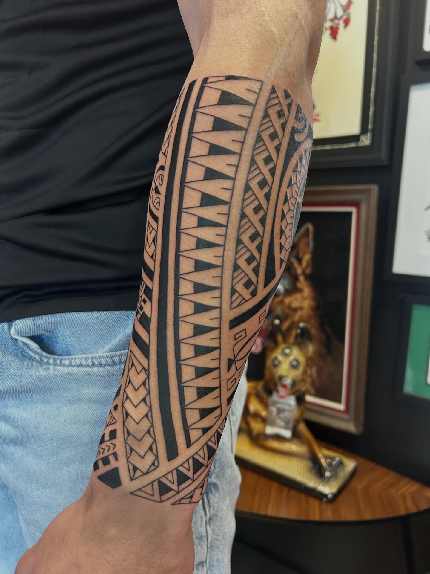 Bold Polynesian Forearm Tattoo