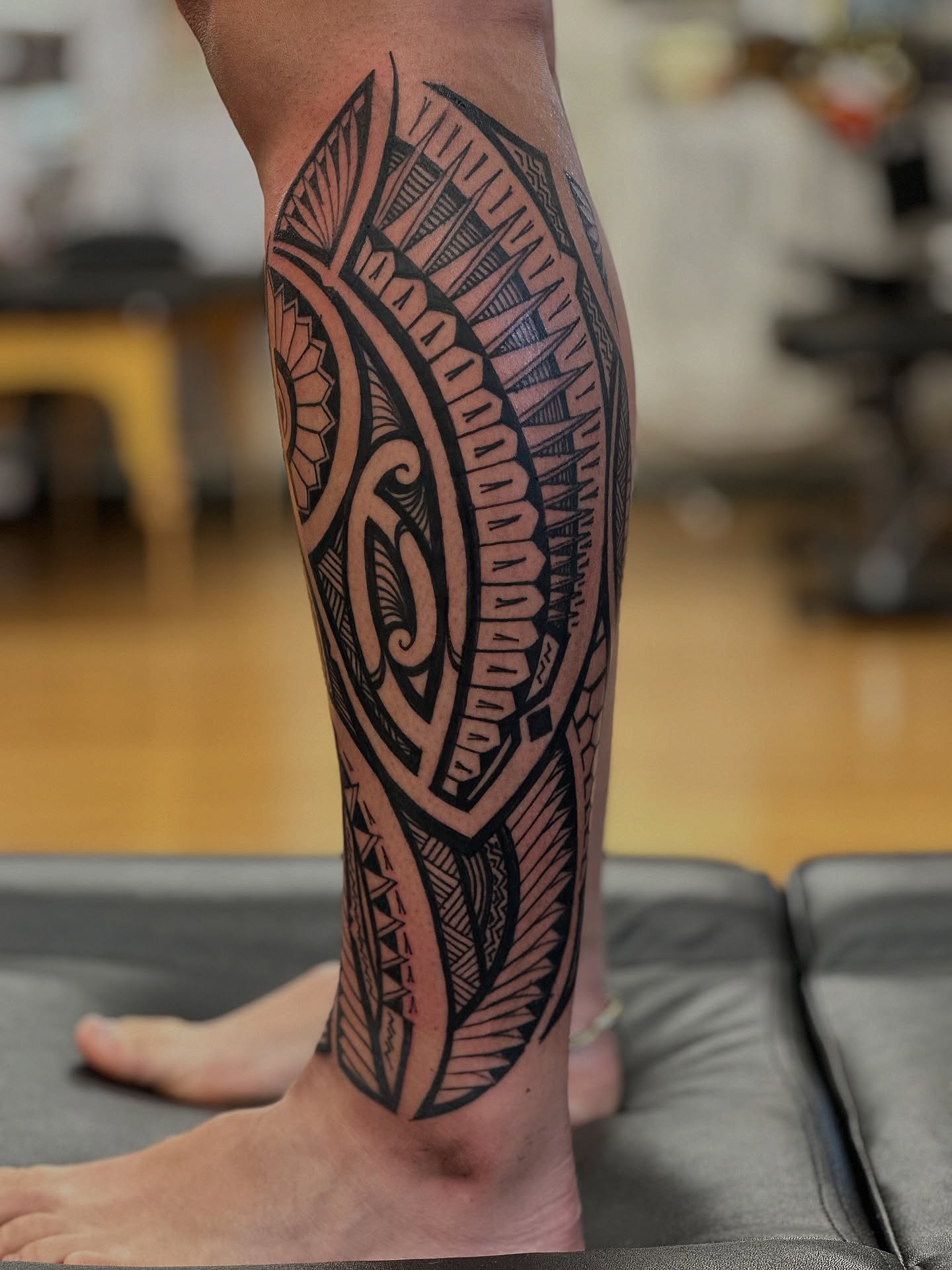 Curved Polynesian Calf Tattoo