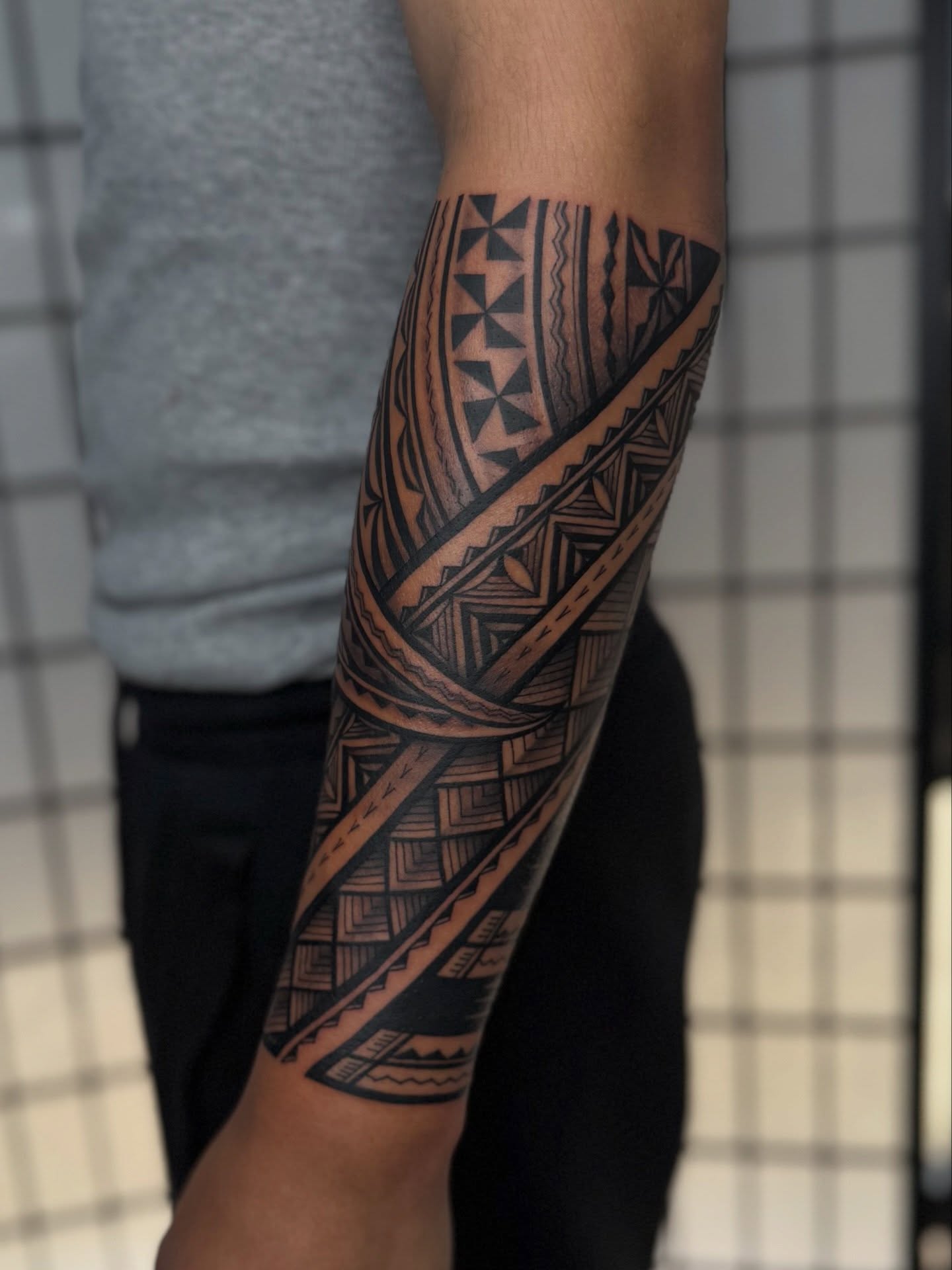 Interwoven Polynesian Forearm Tattoo
