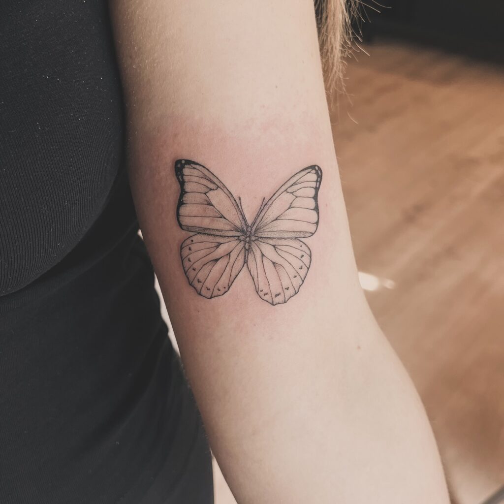 Detailed small butterfly on the upper tricep