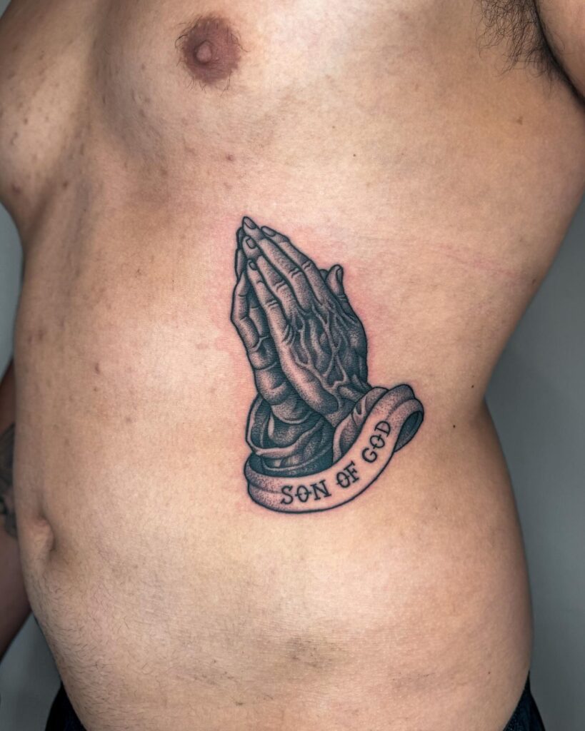 Praying Hands with “Son of God” Banner Tattoo praying hands tattoos tattoo