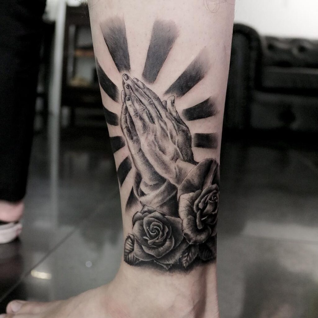 Praying Hands with Radiant Beams and Roses Tattoo praying hands tattoos tattoo