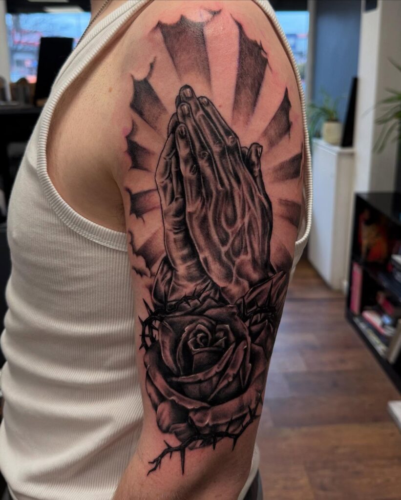 Praying Hands with Radiant Beams and Thorned Rose Tattoo praying hands tattoos tattoo