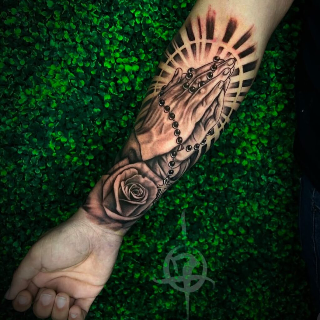 Praying Hands with Rosary, Rose, and Radiant Halo Tattoo praying hands tattoos tattoo