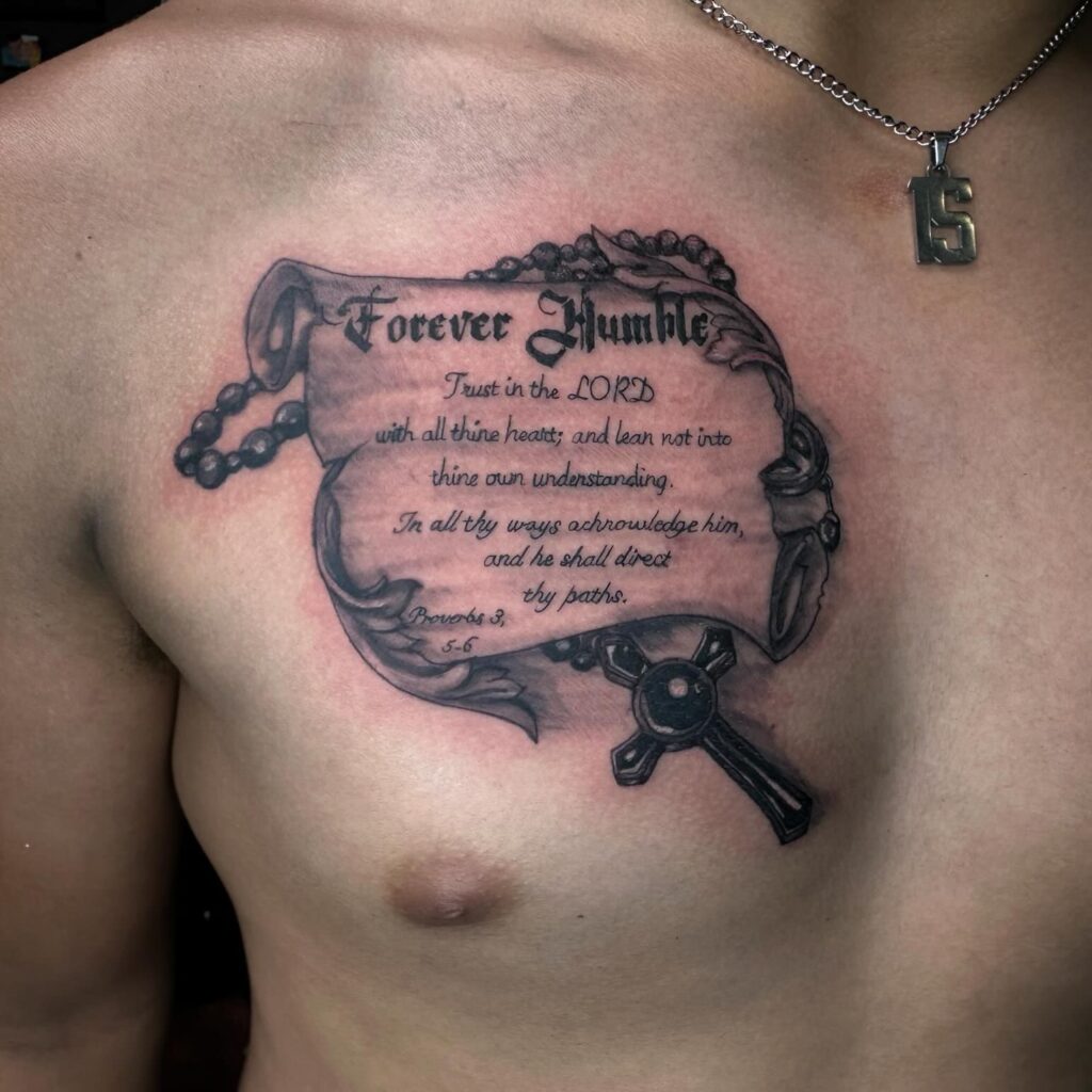 Isaiah 54:17 Bicep Tattoo with Clouds and Bold Lettering bible verse tattoo ideas for men tattoo