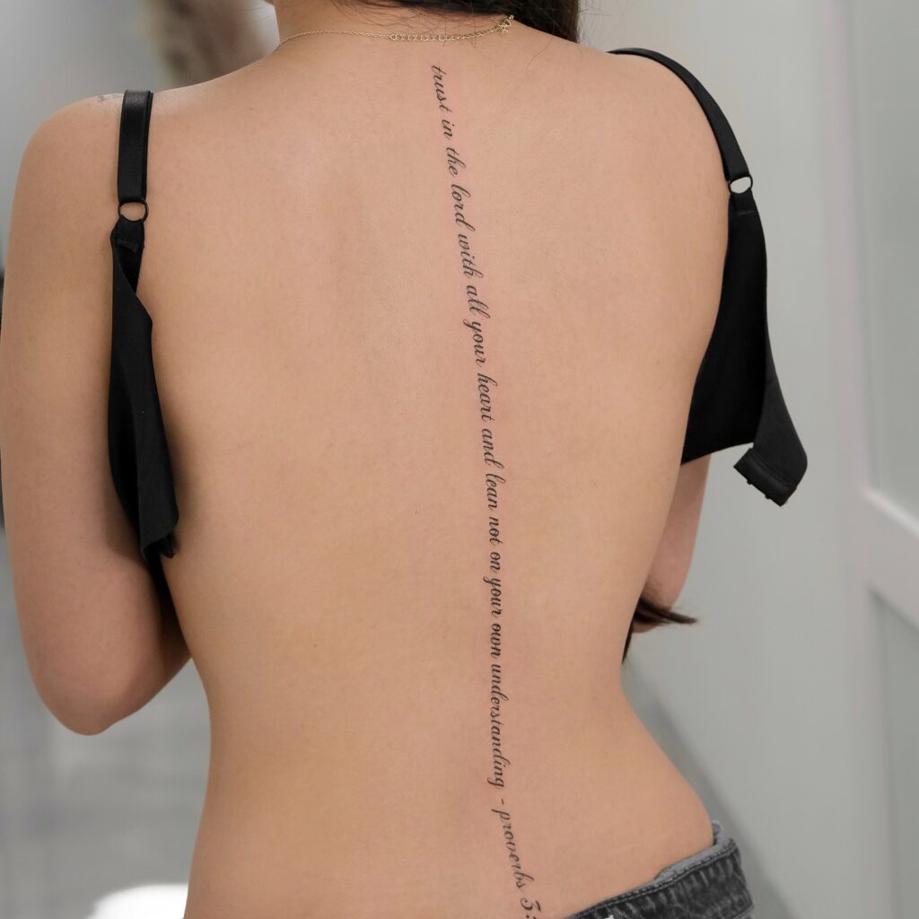 Whimsical Floral And Fairy Spine Tattoo