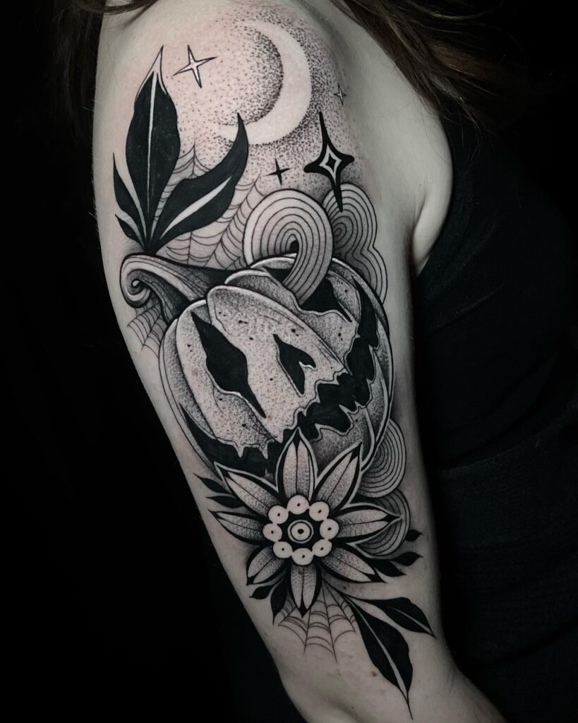 Bright Pumpkin With Lush Green Leaves Tattoo Design