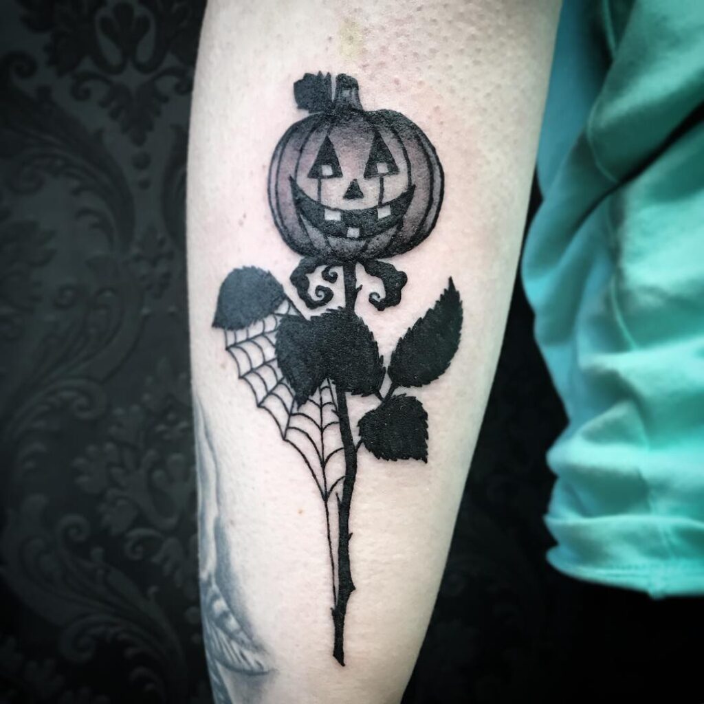 Floral Jack-O -Lantern Sleeve Tattoo
