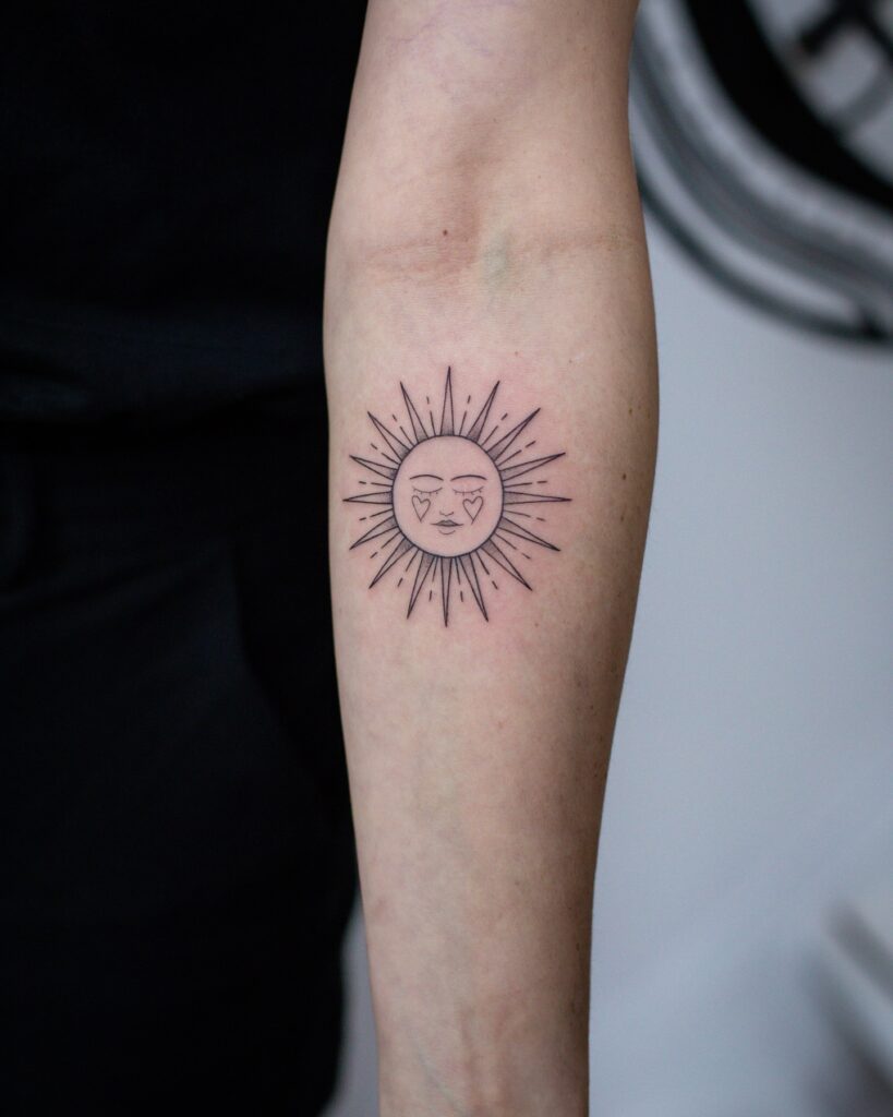Radiant Sun Face Tattoo with Heart Details sun tattoos tattoo