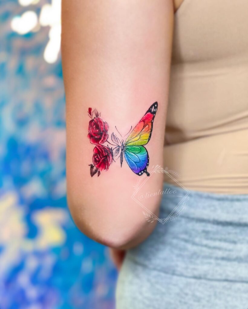 Rainbow Butterfly with Red Roses Tattoo half butterfly half flower tattoos tattoo