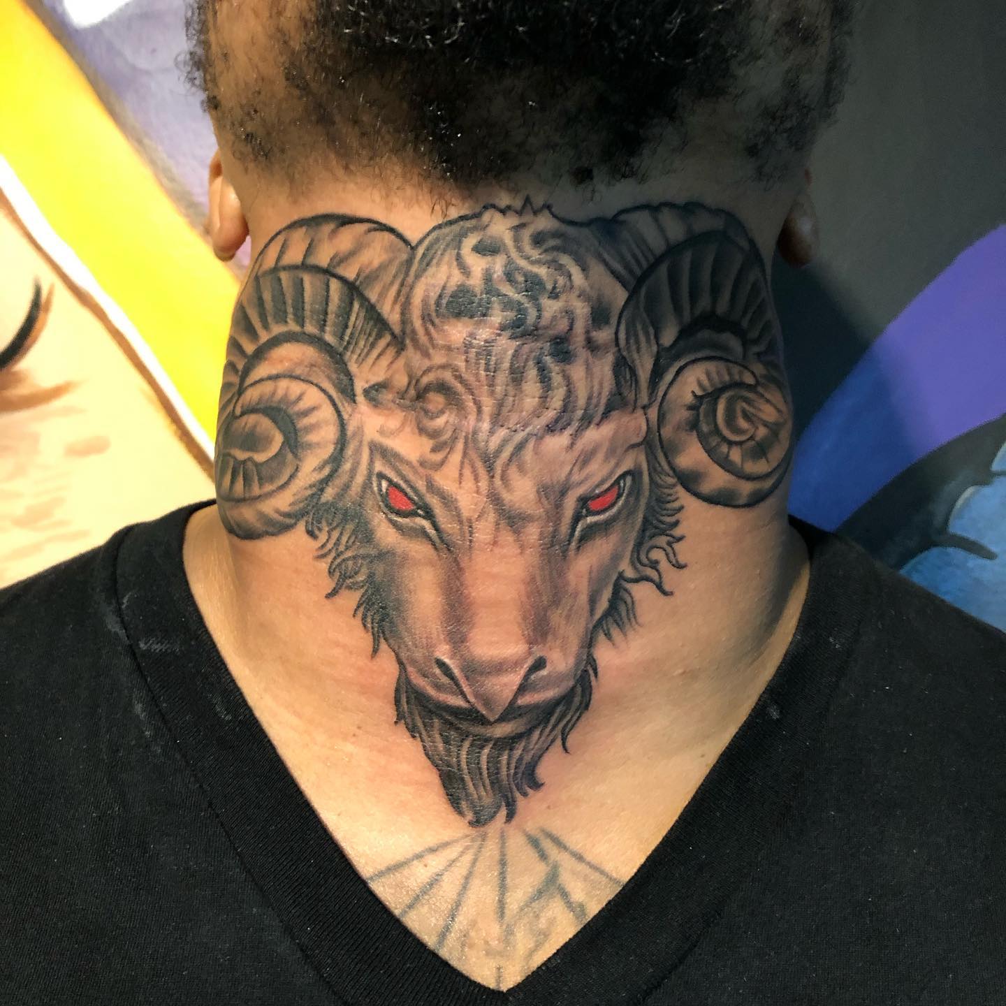 Ram Head Neck Tattoo