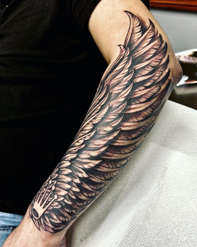 Realistic Angel Wing Forearm Sleeve angel wings tattoo ideas tattoo