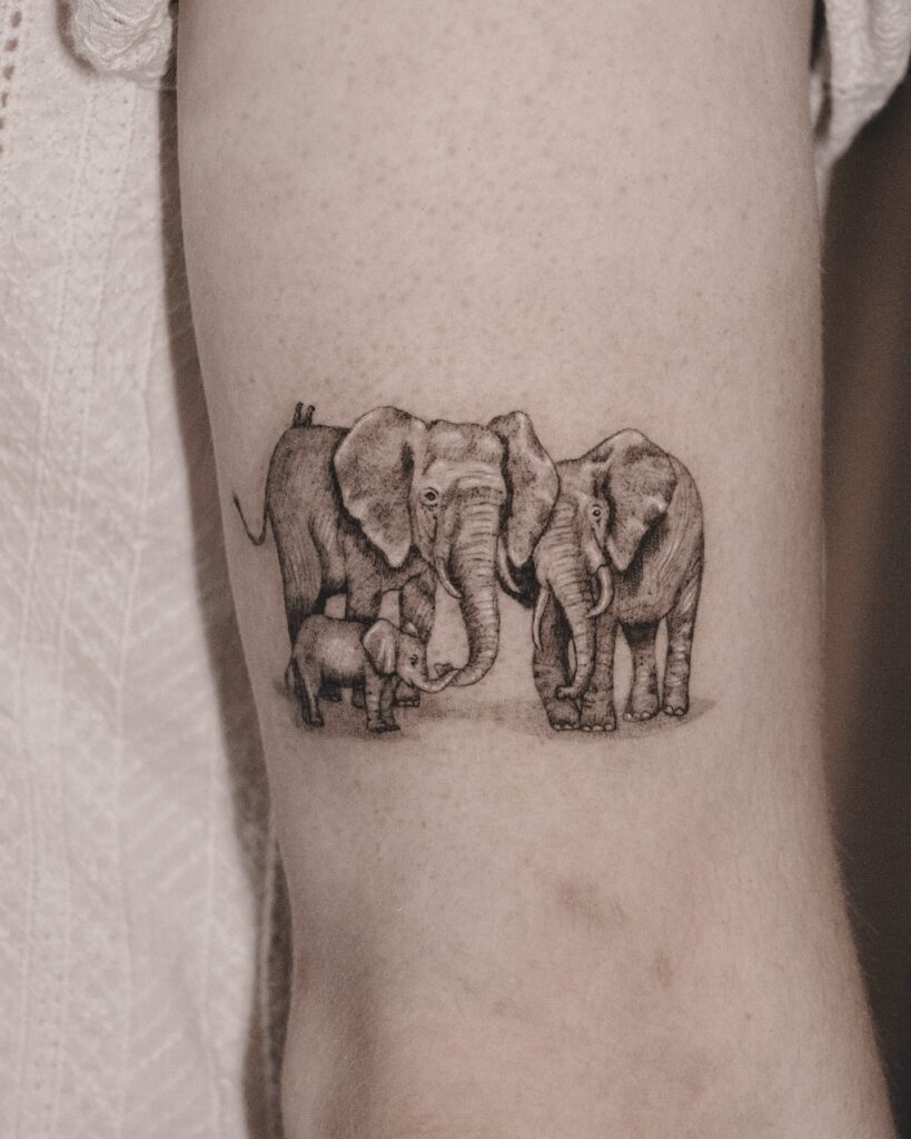 Realistic Elephant Trio Tattoo elephant family tattoo ideas tattoo