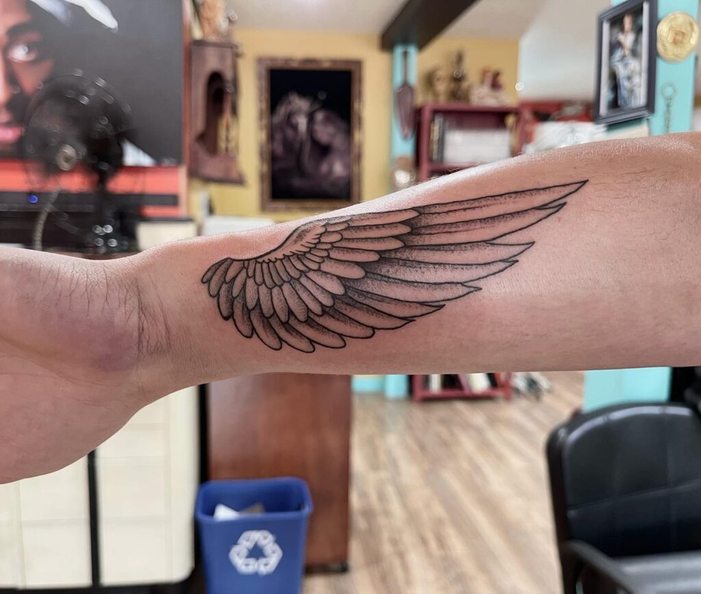 Realistic Forearm Angel Wing Tattoo angel wings tattoo ideas tattoo