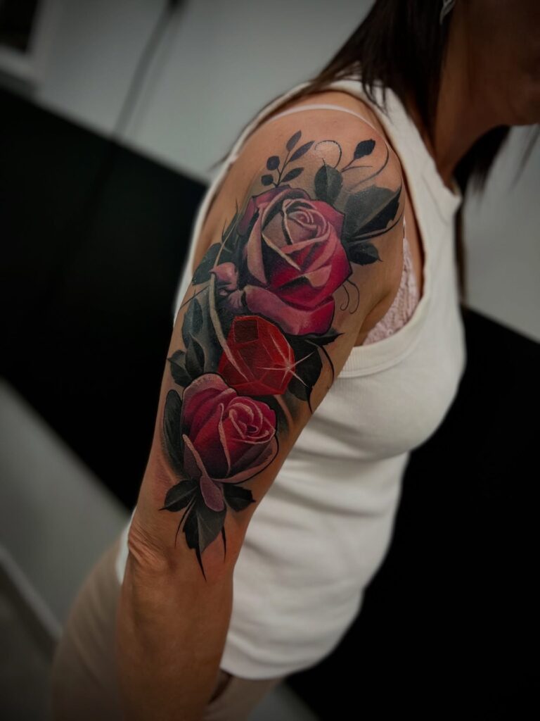 Realistic Red Rose Tattoo with Gem on Upper Arm rose tattoos for women tattoo