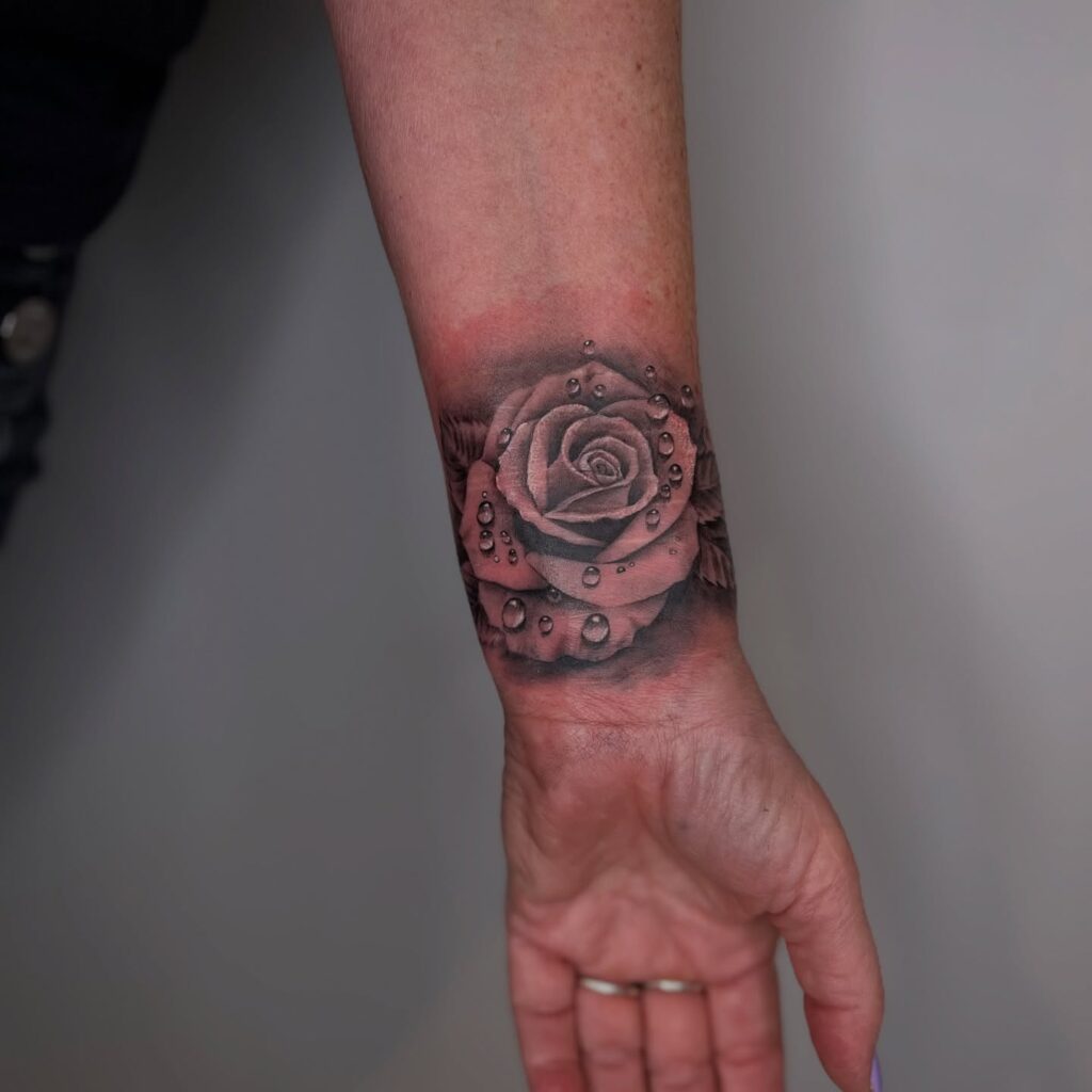 Realistic Rose with Water Droplets Tattoo flower wrist tattoo ideas tattoo