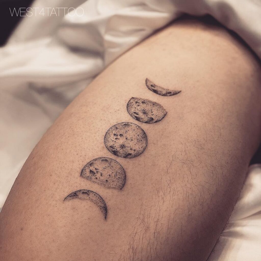 Realistic moon phases thigh tattoo