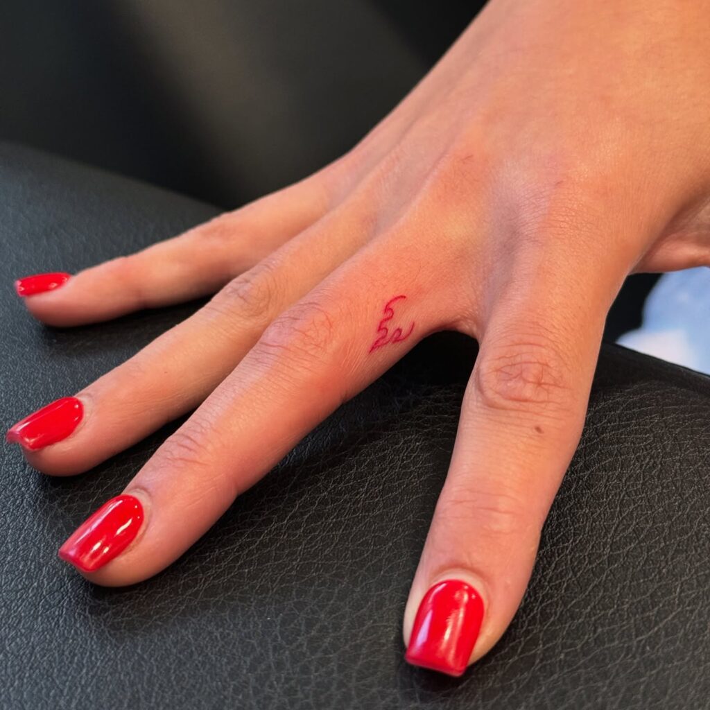 Red Flame Finger Tattoo