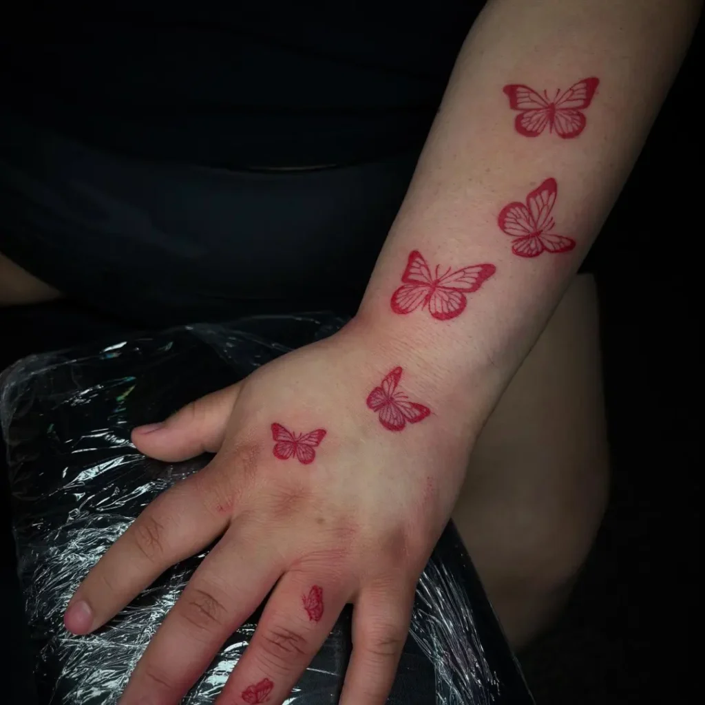 Red Ink Butterfly Trail Tattoo butterfly tattoo designs tattoo